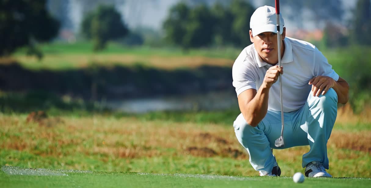 Golfer eyeing up shot