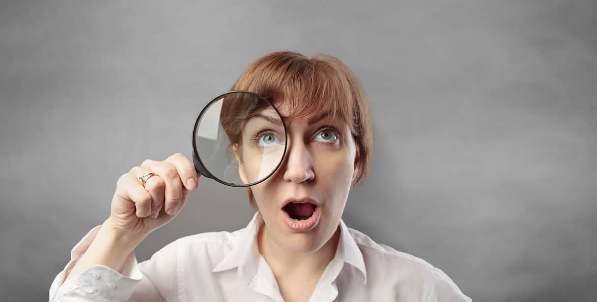 Woman with magnifying glass